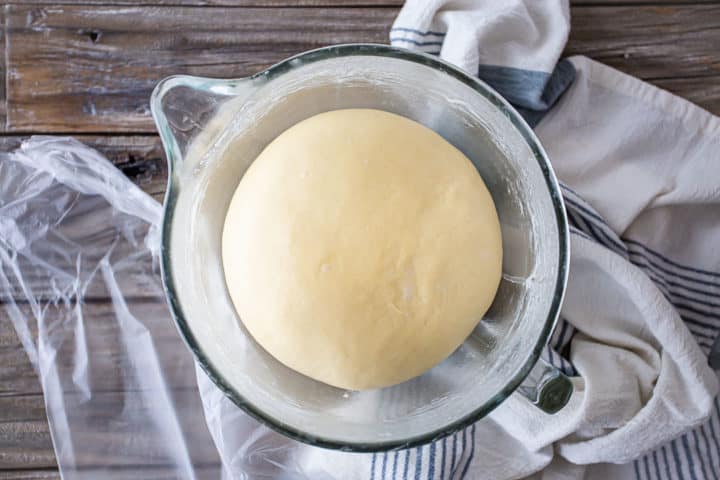 Sticky bun dough risen to twice its original volume.