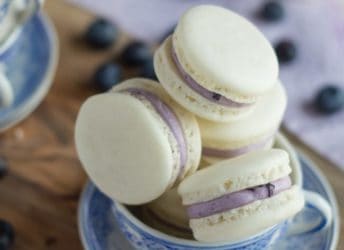 Delicate Almond French Macarons are Sandwiched with a Rich and Creamy Blueberry Mascarpone Filling. A Fresh way to enjoy Seasonal Summer Berries!