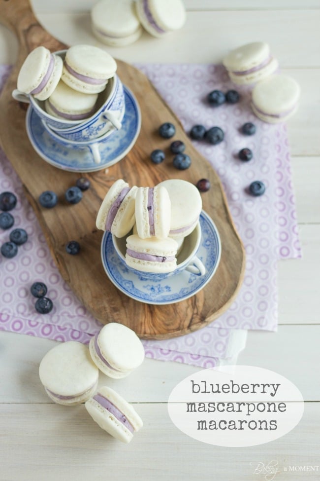 Delicate Almond French Macarons are Sandwiched with a Rich and Creamy Blueberry Mascarpone Filling.  A Fresh way to enjoy Seasonal Summer Berries!