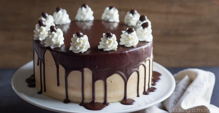 Alternating layers of Angel Food Cake and Devils Food Cake are filled with Salted Caramel Mousse, frosted with Espresso Swiss Meringue Buttercream, and glazed with a Decadent Dark Chocolate Ganache. 