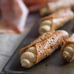 Such a fun Fall treat! Pumpkin Cannoli with a creamy, spiced filling & a nutty almond brittle shell