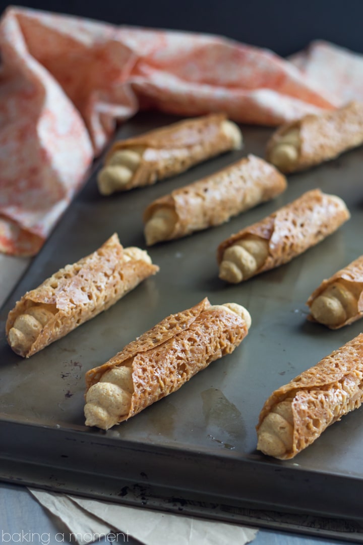 Such a fun Fall treat! Pumpkin Cannoli with a creamy, spiced filling & a nutty almond brittle shell.
