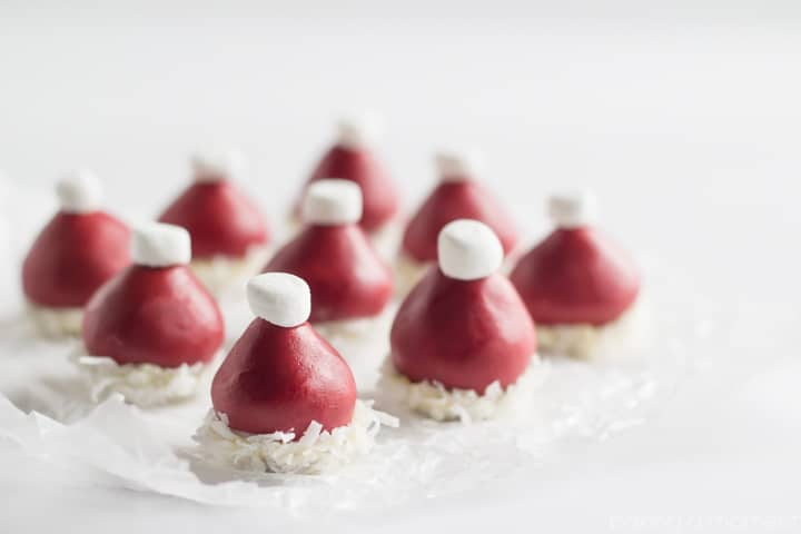 Red Velvet Cookie Dough Truffles in the shape of a Santa hat!  How cute!  Making these to give as gifts.  #TasteTheSeason #ad