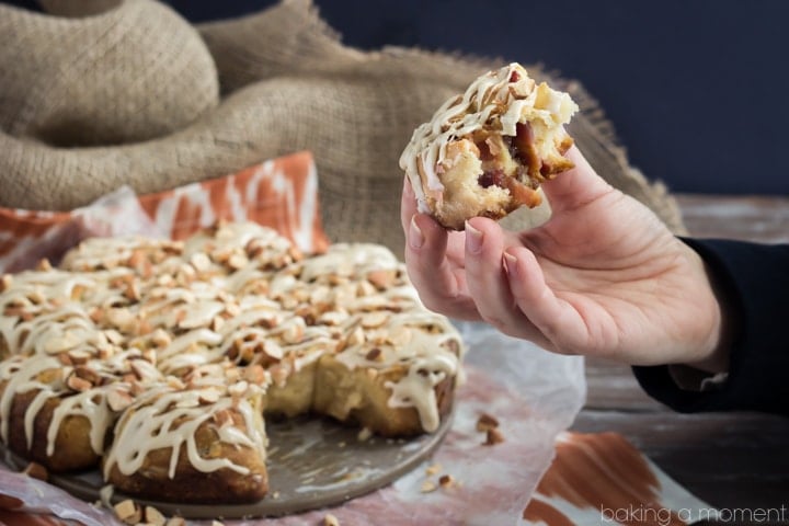 Angel Biscuits are like a fluffy buttermilk biscuit but with the gooiest, most delicious yeasty flavor.  This version is rolled up with bacon and dates, drizzled with a maple glaze, and sprinkled with crunchy almonds.  Swoon!  