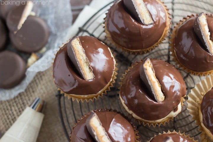 Peanut Butter Tagalong Cupcakes!  These were one of the best things I have EVER MADE!  Moist vanilla cupcake on top of a Peanut Butter Tagalong (Girl Scout) Cookie, with a Peanut Butter Frosting full of crushed cookies!  And then it gets dipped in chocolate and you totally swoon.