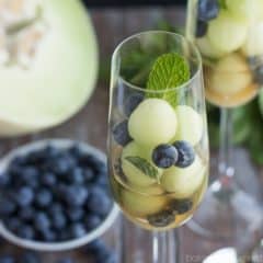 Simple as can be and so refreshing! These melon balls in tea with blueberries and mint will definitely be making an appearance at our next brunch! #ad