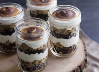 Perfect for a barbecue or potluck! These S'mores Cupcake Jars transport easily and they are TO DIE FOR! Soft and sweet, with just the right amount of crunch. They'll be the hit of the party!