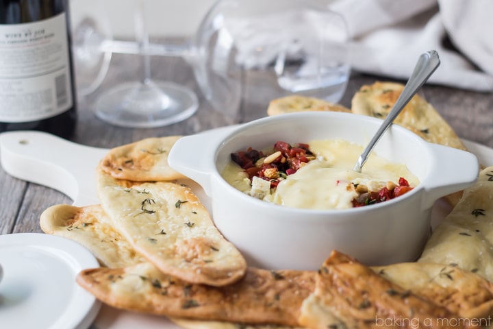 Serve this simple appetizer at your next get-together! The baked cheese is so creamy, and couldn't be easier to make, and the roasted red pepper relish has tons of smoky-sweet flavor! Scoop it all up with crunchy homemade herbed flatbreads. @marthastewart @macys #marthastewartcollection #mscollection