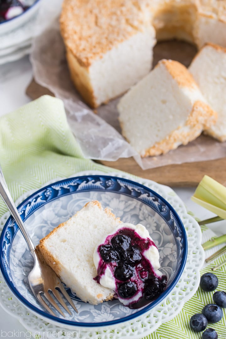 Classic Angel Food Cake: perfectly sweet & light as a cloud, served with fresh whipped cream and a citrus-y blueberry lemongrass topping. 