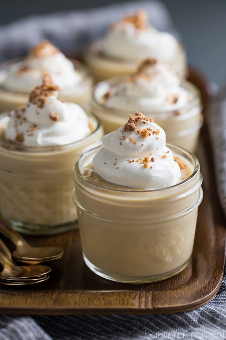 Homemade butterscotch pudding, topped with soft whipped cream and toffee bits.