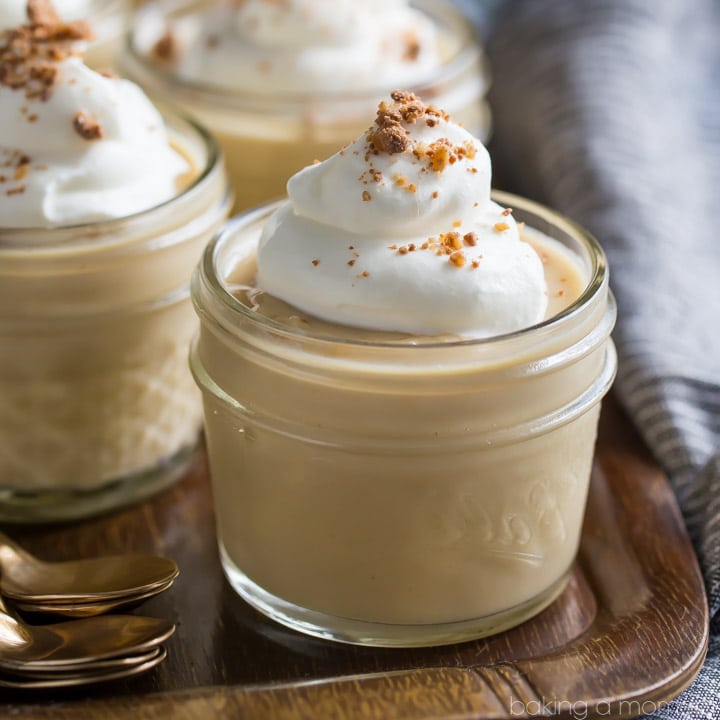 Homemade butterscotch pudding in a small glass jar.