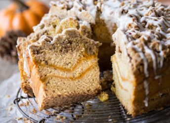 Pumpkin Spice Coffee Cake: moist sour cream coffee cake infused with pumpkin spice, ribboned with pumpkin and topped with a crunchy cinnamon crumb topping. Perfect for fall! #PumpkinDelight #IDelight @indelight #ad