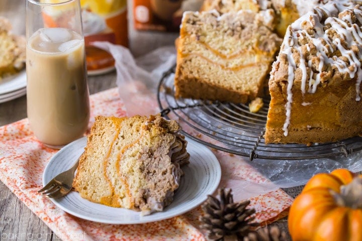 Pumpkin Spice Coffee Cake: moist sour cream coffee cake infused with pumpkin spice, ribboned with pumpkin and topped with a crunchy cinnamon crumb topping. Perfect for fall! food brunch cake #PumpkinDelight #IDelight @indelight #ad