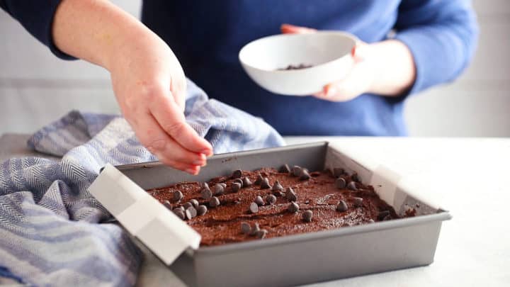 Baking brownies with chocolate chips on top.