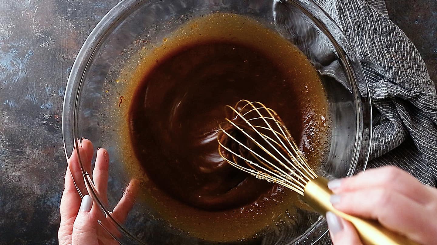 Whisking filling for chocolate pecan pie.