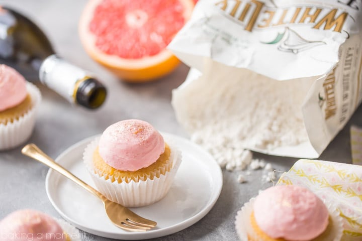 Grapefruit Champagne Mimosa Cupcakes: So light and fluffy, with a sweet, citrus-y zing and a gorgeous pink color! Perfect for New Years Eve or a girl's party. #BakeYourPassion #sponsored @whitelilyflour food desserts cupcakes