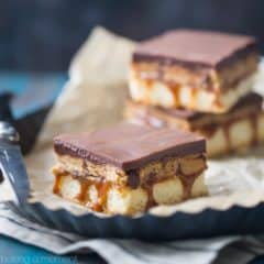Peanut Butter Cookie Dough Billionaire Bars: OMG! These are so sinful- buttery shortbread with gooey caramel, edible peanut butter chocolate chip cookie dough, and a thick layer of chocolate ganache. Swoon!