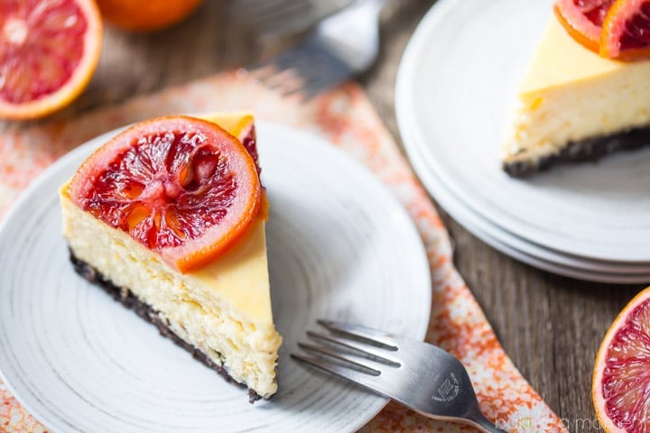 Blood Orange Cheesecake: the candied orange slices are so pretty and the citrus flavor works so well against the creamy cheesecake! The crunchy chocolate cookie crust is the perfect compliment. food desserts cheeesecake