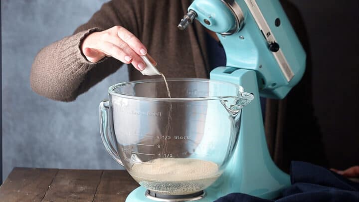 Sprinkling yeast over warm water.