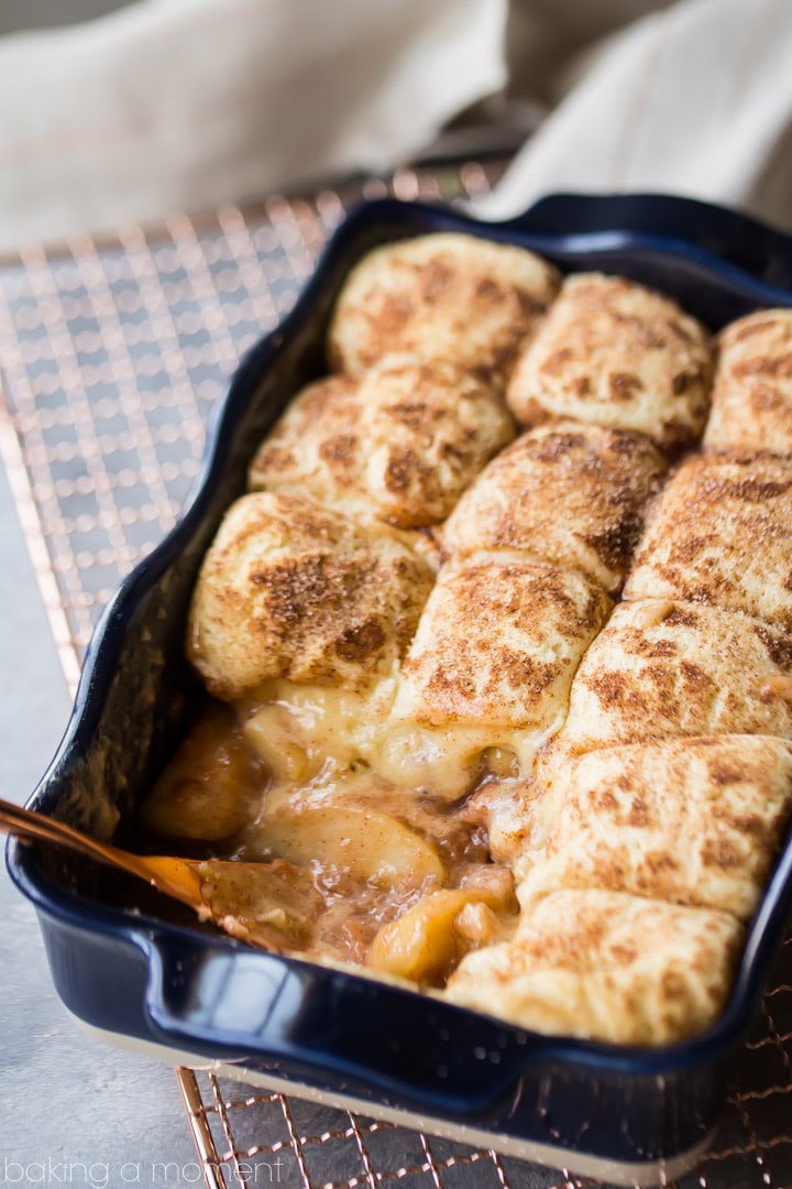 Snickerdoodle Apple Cobbler: soft baked apple filling topped with cinnamon-sugar-y snickerdoodle cookies!  This makes your whole house smell amazing!  #food #desserts #apple #cinnamon #comfortfood #baking 