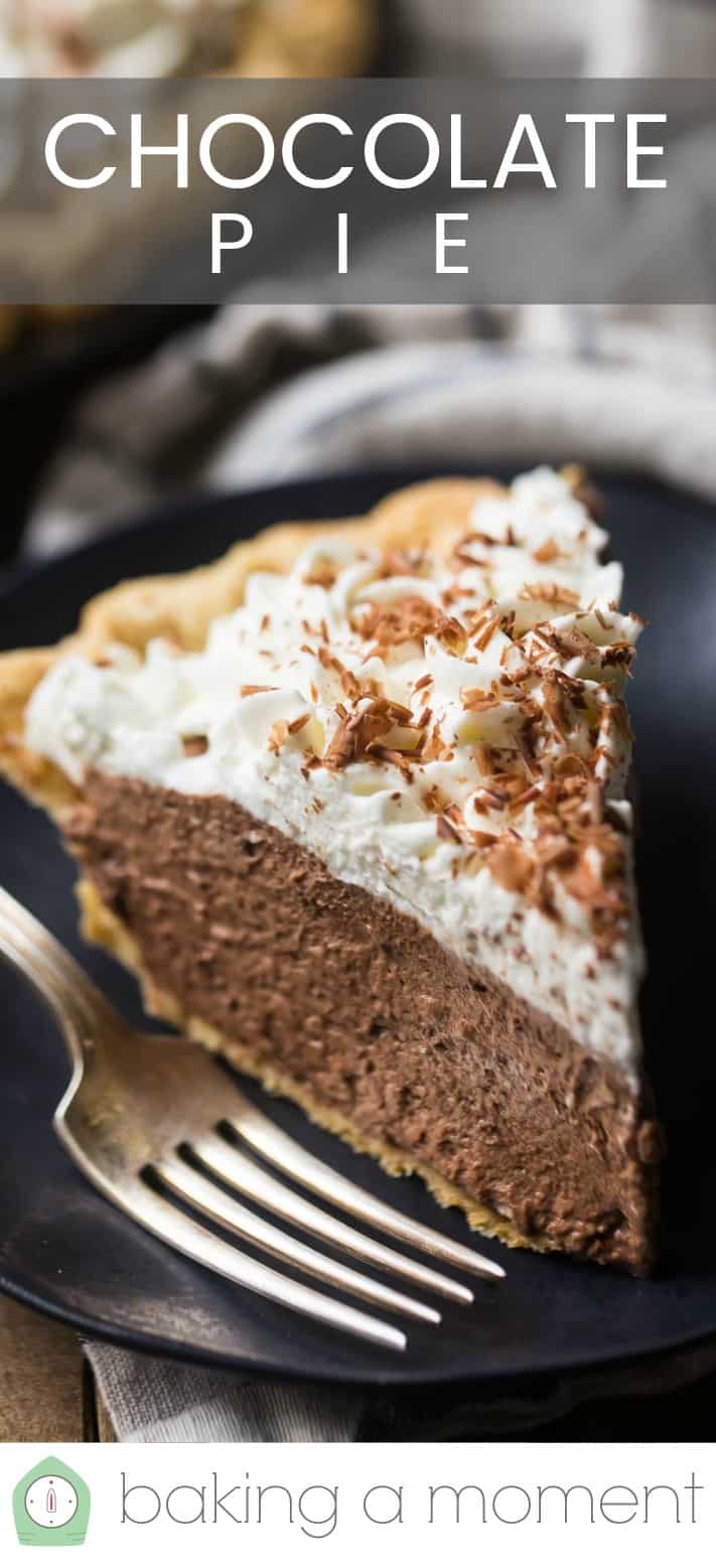 Close up image of a slice of homemade chocolate cream pie on a dark plate with a silver fork and a text overlay above that reads "Chocolate Pie."