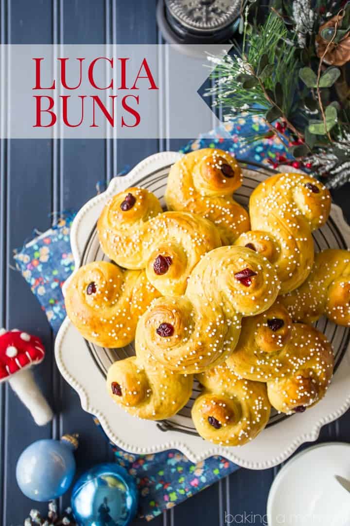 Saffron-scented Lucia Buns, sprinkled with sugar and garnished with dried cranberries. A centuries old Scandanavian tradition- so light and soft, and perfect with a cup of coffee! #food #bread #desserts #baking #swedish #luciabuns #stluciaday #holiday
