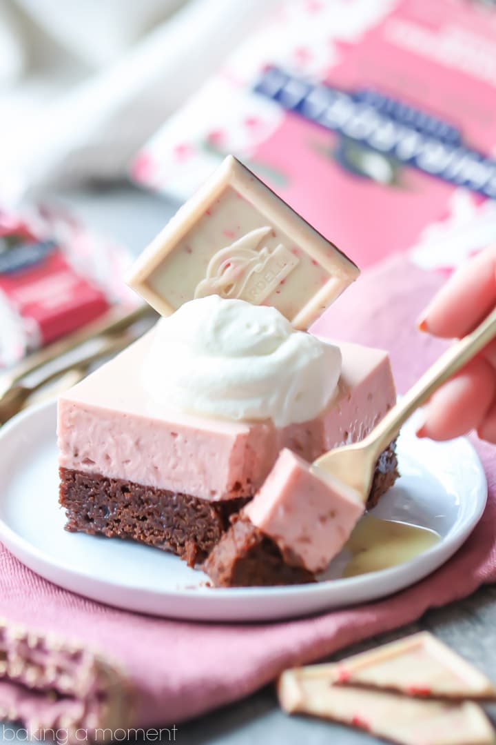 Chocolate Strawberry Mousse Bars: layers of nearly-flourless chocolate torte and airy strawberry mousse, topped with a white chocolate glaze.  Whisper-light and so pretty!  #food #desserts #chocolate #strawberry #valentinesday #pink #mousse