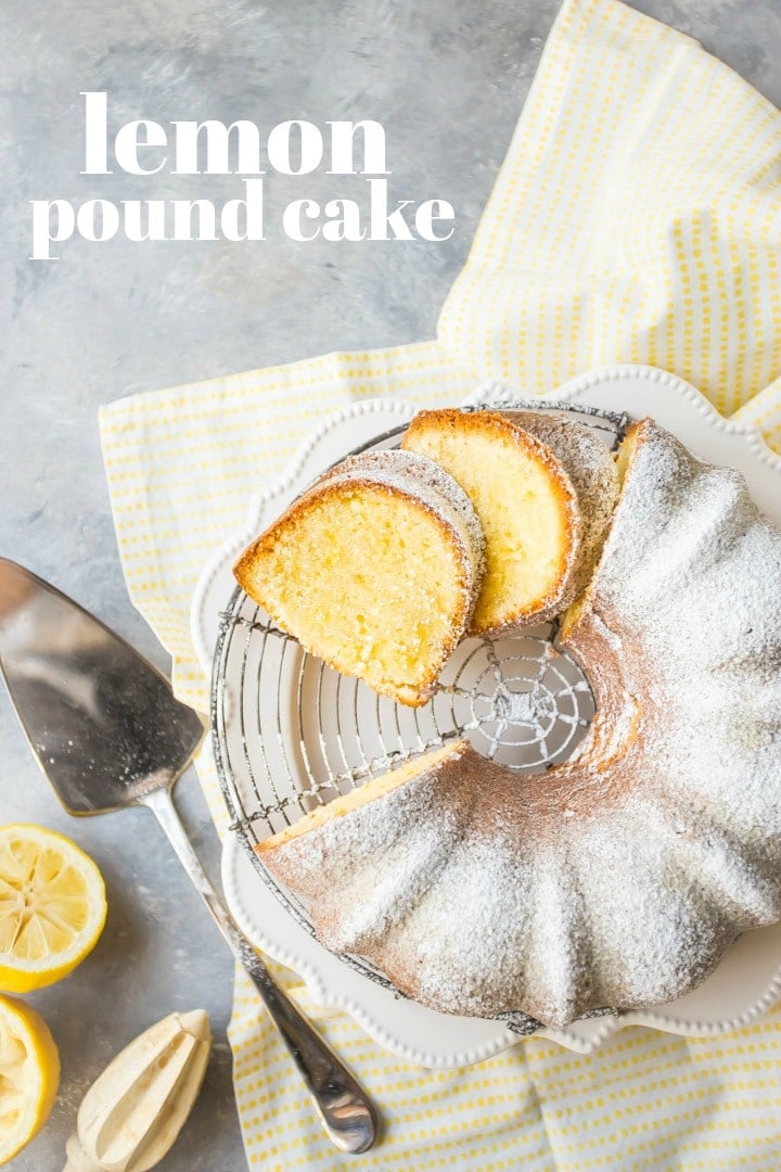Overhead view of sliced lemon pound bundt cake, dusted with powdered sugar, on a cooling rack with a yellow napkin.  Cake server, fresh lemons, and lemon juicer are off to one side, and there is a text overlay. 