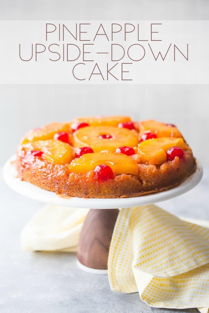 Vertical image with text overlay of a pineapple upside down cake on a white cake stand with a yellow napkin.