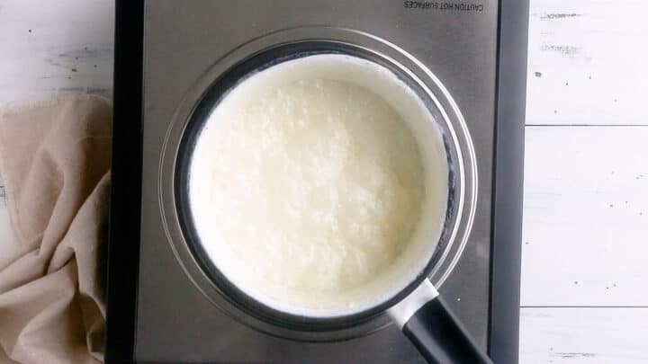 A small pot of cream simmering gently.