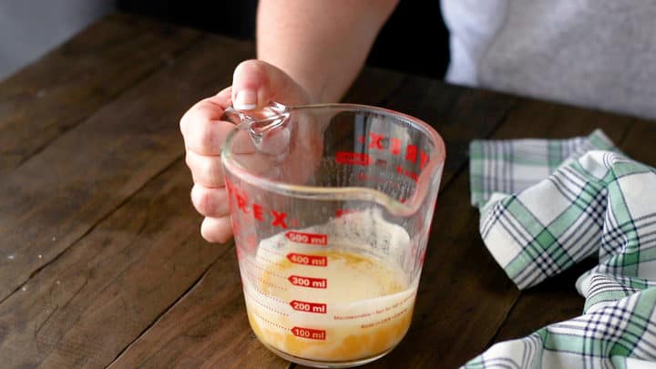 Melted butter in a large liquid measuring cup.
