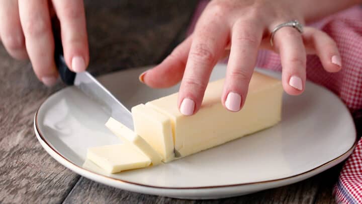 Slicing cold butter thinly.