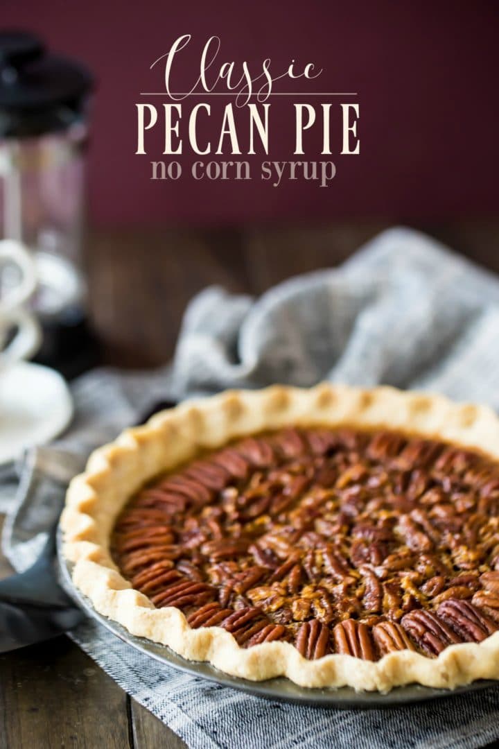 Easy pecan pie recipe, baked with a crimped crust and presented against a burgundy backdrop.