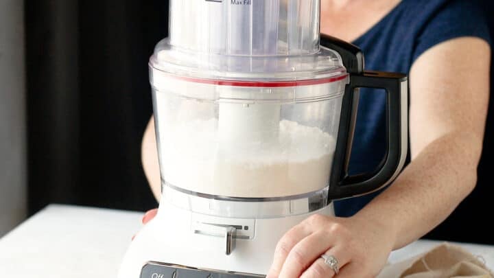 Pulsing dry ingredients together in a food processor.