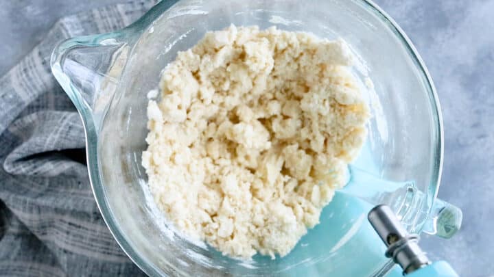 Butter and dry ingredients, mixed until it resembles damp sand.