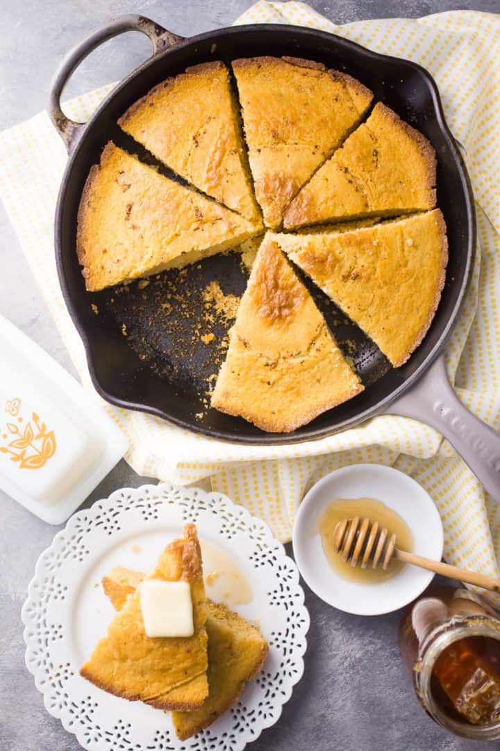 Old-fashioned cornbread recipe, baked in a cast iron skillet and cut into wedges.