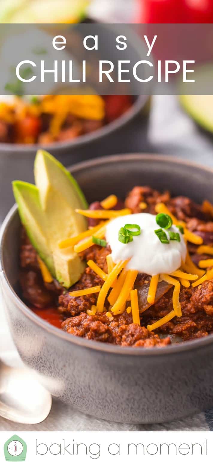 Close-up image of a bowl of chili, topped with cheese, sour cream, and avocado, with a text overlay reading "Easy Chili Recipe."