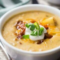 Close-up image of a bowl of loaded baked potato soup, with a text overlay reading "Loaded Baked Potato Soup."