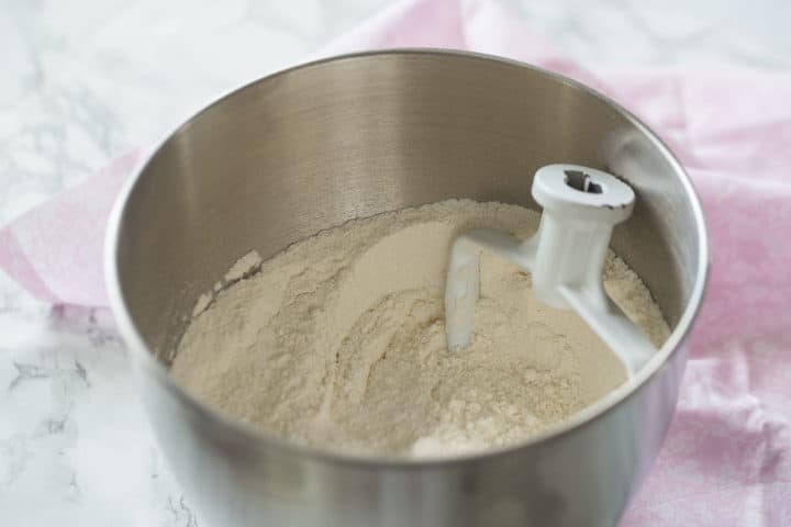 Mixing dry ingredients for white almond sour cream cake.
