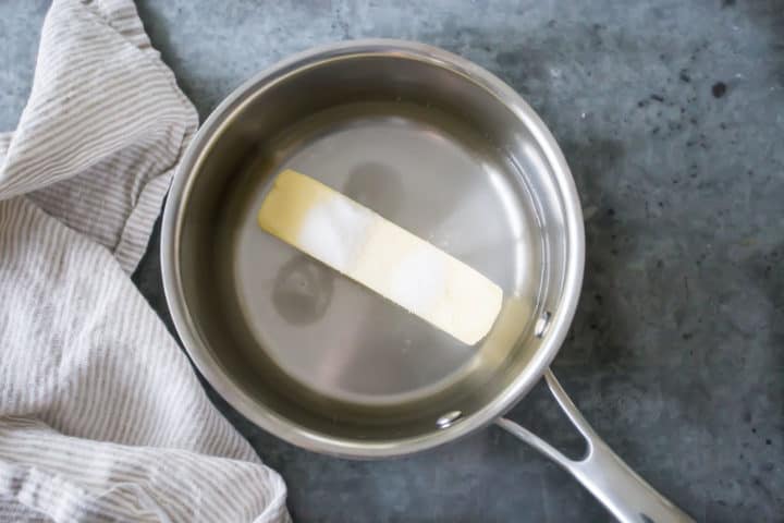 Water, butter, sugar, and salt in a small pot.