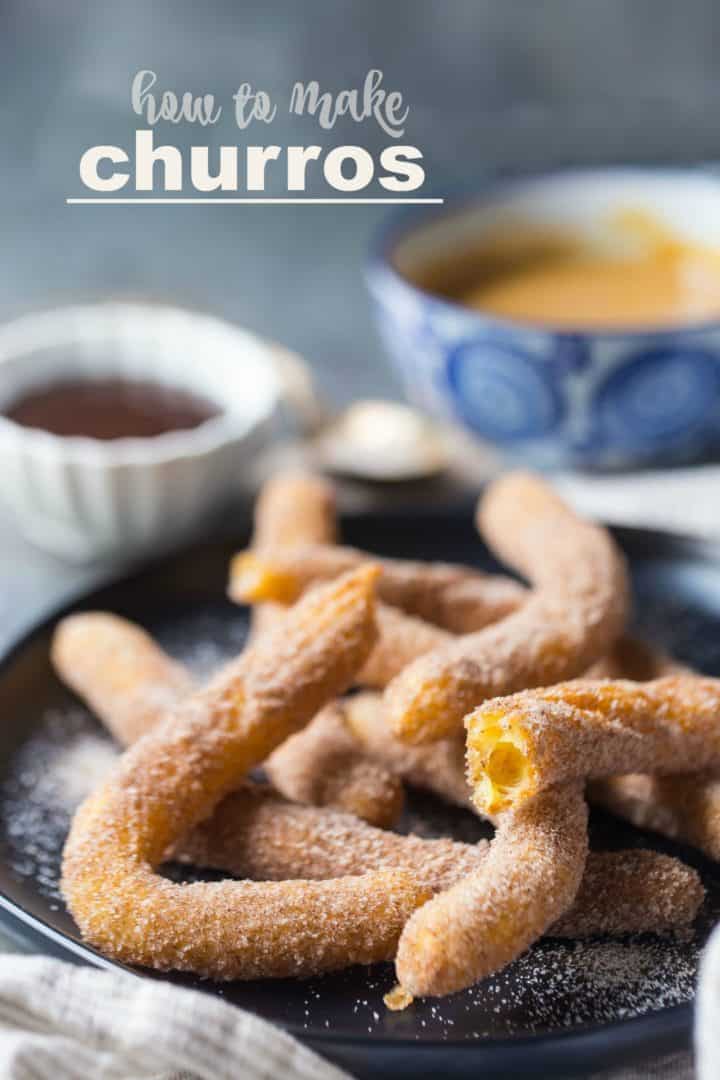 Homemade churros on a plate with cinnamon sugar and a text overlay reading "How to Make Churros."