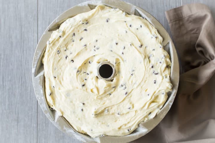 Chocolate chip cake batter in a bundt pan.