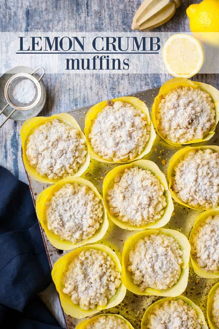 Overhead view of lemon crumb muffins in tin with yellow papers, and a text overlay reading "Lemon Crumb Muffins."