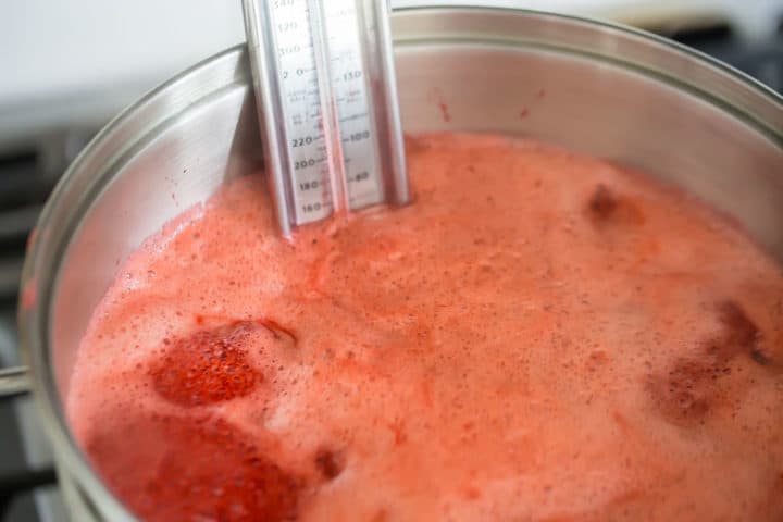 Boiling homemade strawberry jam.