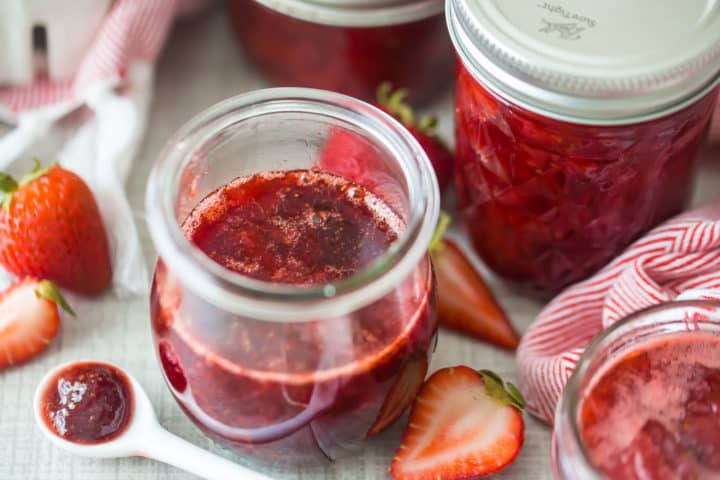 Jars of homemade strawberry preserves.