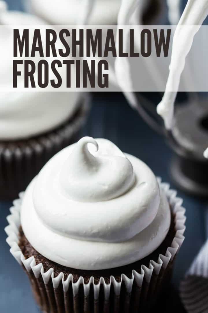 Marshmallow frosting piped in a swirl on a cupcake with a text overlay reading "Marshmallow Frosting."