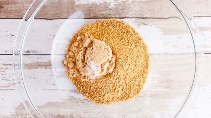 Graham cracker crumbs, brown sugar, and salt in a large glass mixing bowl.