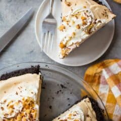 Overhead image of a slice of easy peanut butter pie with an orange checked cloth.