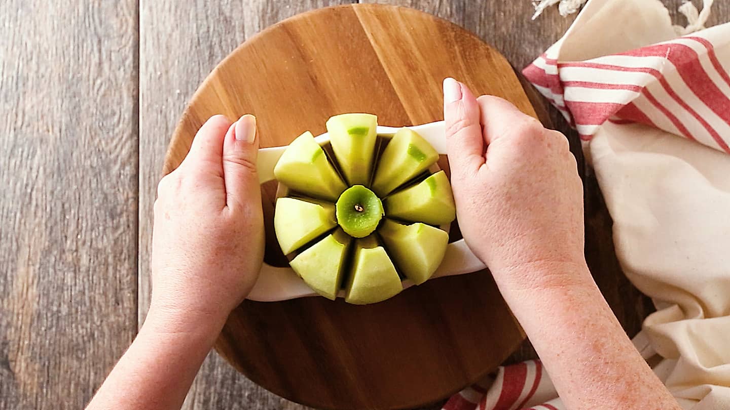 Cutting apples into eighths for apple dumplings.