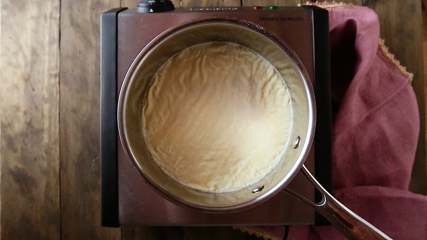 Making panna cotta: Softening gelatin.